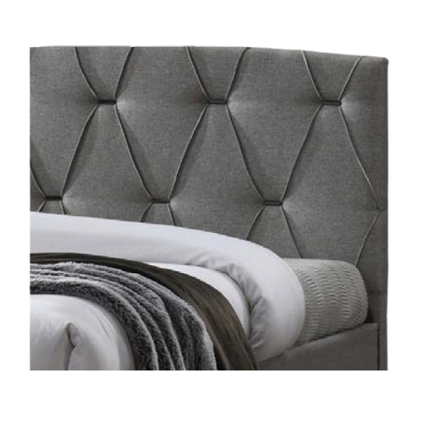 A stylish bed featuring a decorative headboard and footboard, showcasing a modern design in a cozy bedroom setting.