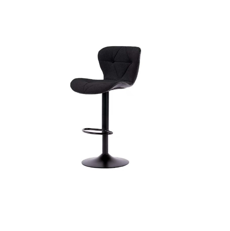 Chic black bar stools positioned together, offering a fresh and inviting look for a dining or bar setting.