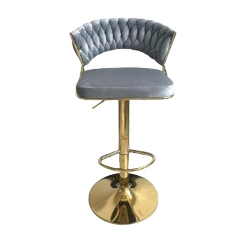 A stylish gold bar stool with a comfortable velvet seat, perfect for enhancing contemporary decor.