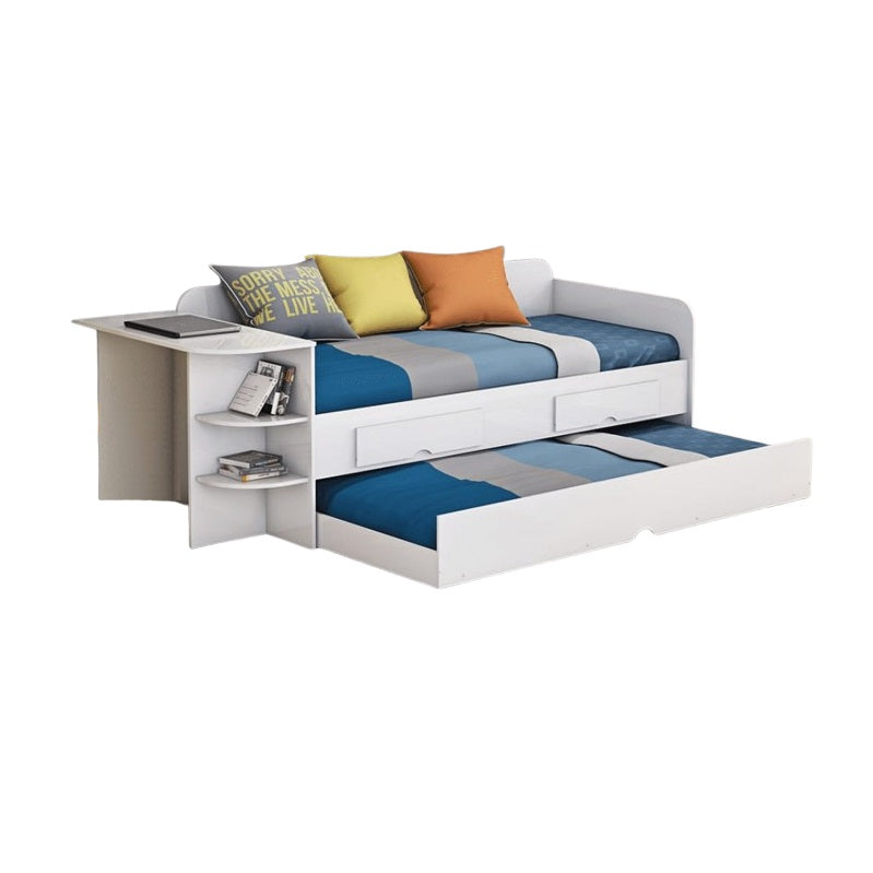 A cozy white daybed decorated with cheerful blue and yellow pillows, enhancing the room's aesthetic appeal.