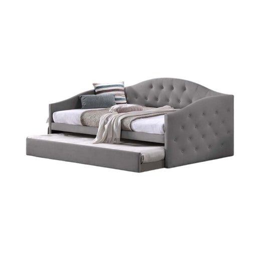 A modern daybed with an integrated pull-out drawer underneath, perfect for maximizing space in any room.