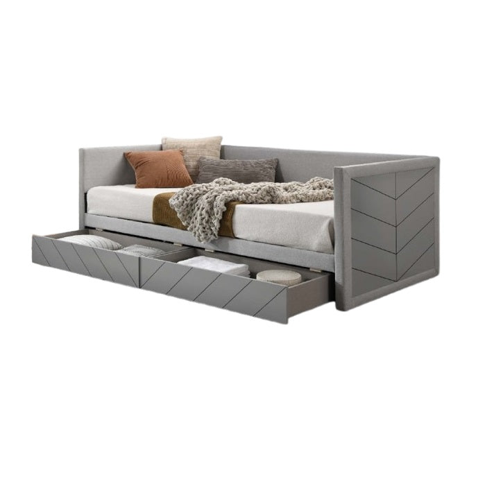 A stylish gray daybed with built-in drawers and a crisp white pillow, perfect for a cozy living space.