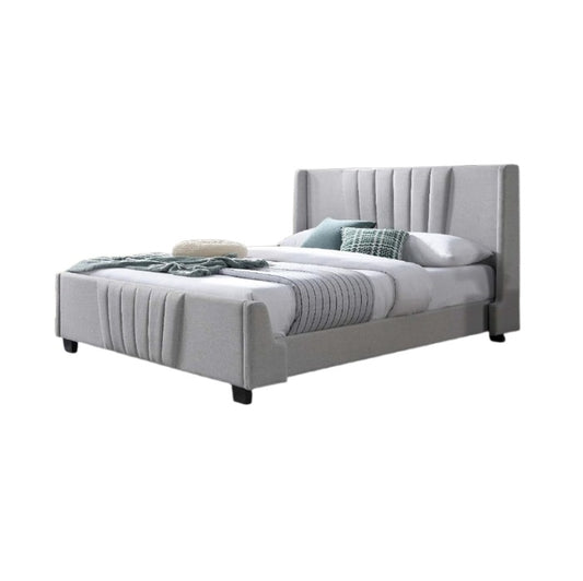A stylish bed featuring a decorative headboard and footboard, showcasing a modern design in a cozy bedroom setting.