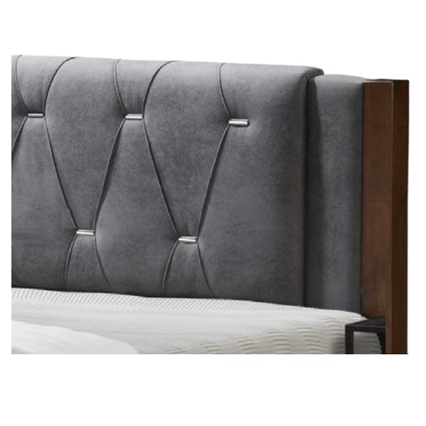 A stylish bed featuring a decorative headboard and footboard, showcasing a modern design in a cozy bedroom setting.