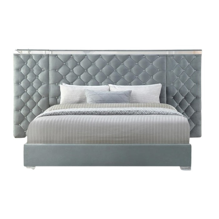 A stylish bed featuring a decorative headboard and footboard, showcasing a modern design in a cozy bedroom setting.