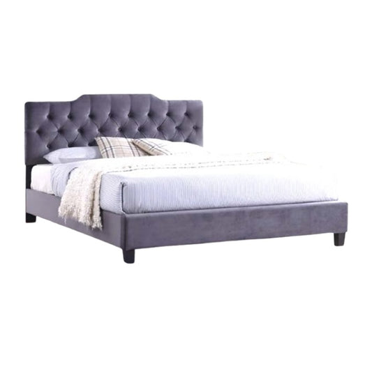 A stylish bed featuring a decorative headboard and footboard, showcasing a modern design in a cozy bedroom setting.