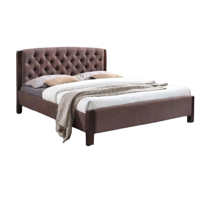 A stylish bed featuring a decorative headboard and footboard, showcasing a modern design in a cozy bedroom setting.