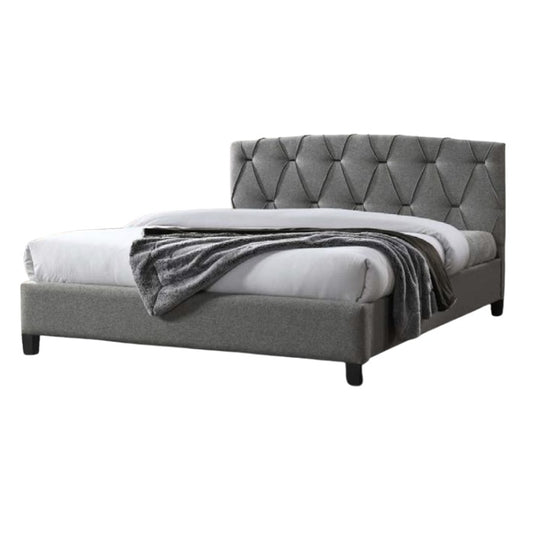 A stylish bed featuring a decorative headboard and footboard, showcasing a modern design in a cozy bedroom setting.
