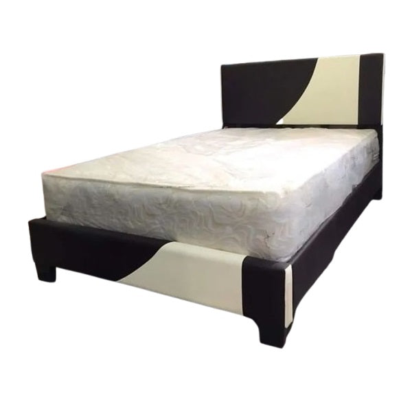 A bed adorned with a minimalist white and black pattern, adding elegance to any bedroom décor.