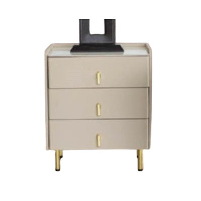 A bedside table adorned with a clock and several photographs, enhancing the room's intimate and inviting ambiance.