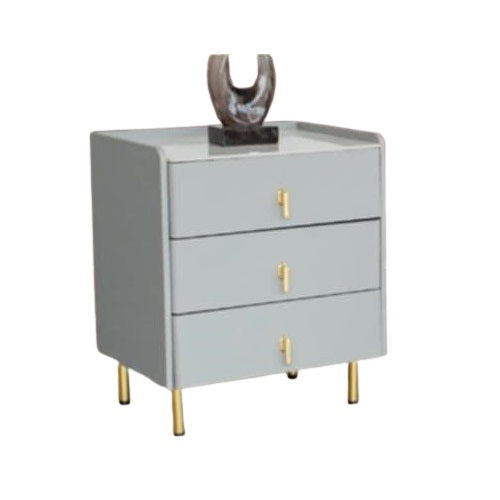 A bedside table adorned with a clock and several photographs, enhancing the room's intimate and inviting ambiance.