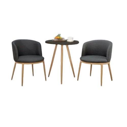 Two chairs flanking a round table, offering a welcoming space for conversation or dining.