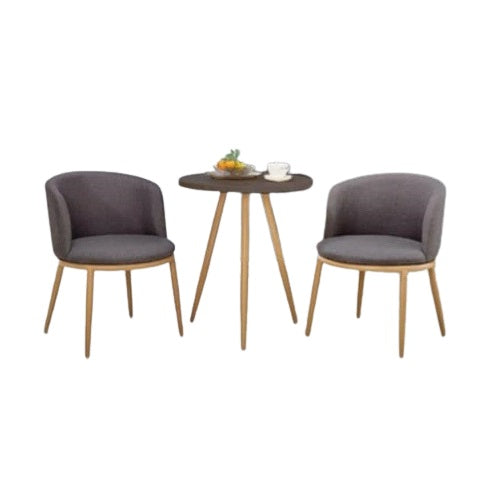 Two chairs flanking a round table, offering a welcoming space for conversation or dining.