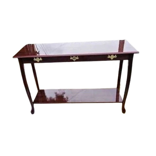 A rectangular table featuring a sleek  base and a warm wooden top, ideal for dining or workspace settings.