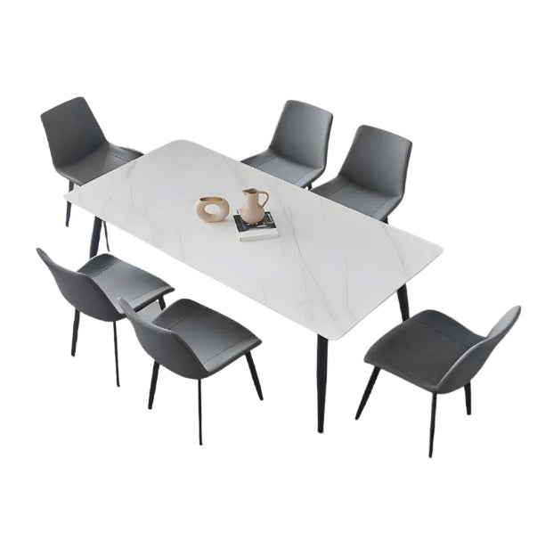 A modern dining table with matching chairs, designed for comfort and social dining experiences.