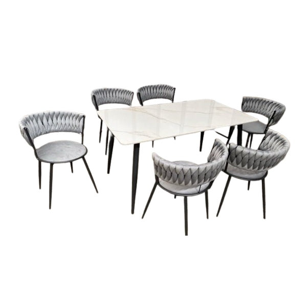 A stylish dining set featuring a table surrounded by elegant chairs, perfect for family meals and gatherings.