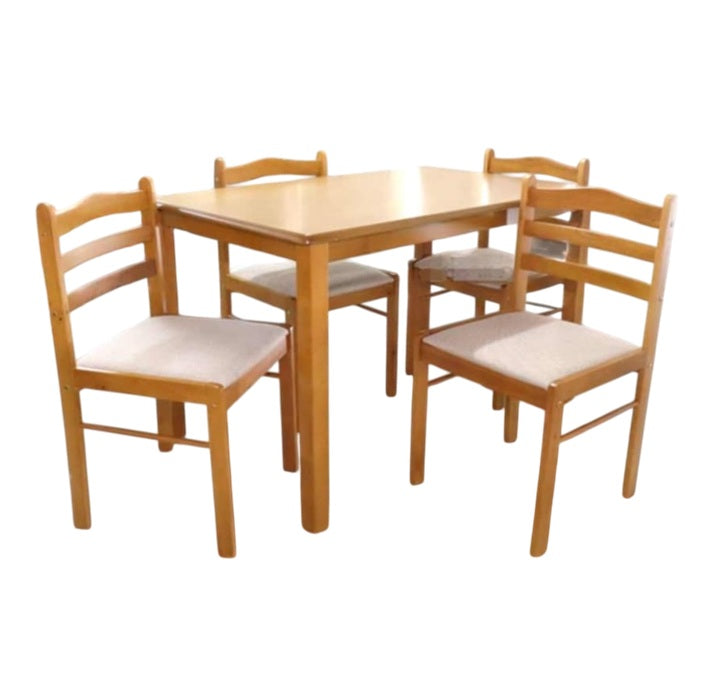 A modern dining table with matching chairs, designed for comfort and social dining experiences.