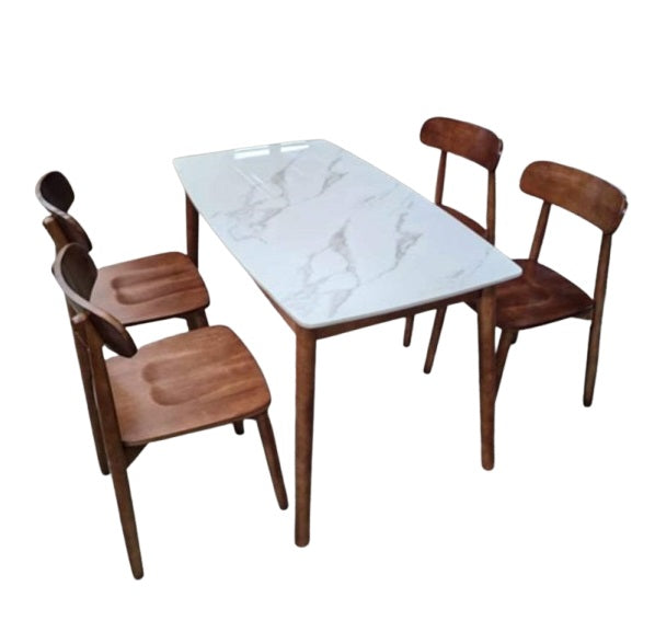 A white marble table surrounded by four elegant chairs, creating a sophisticated dining area.