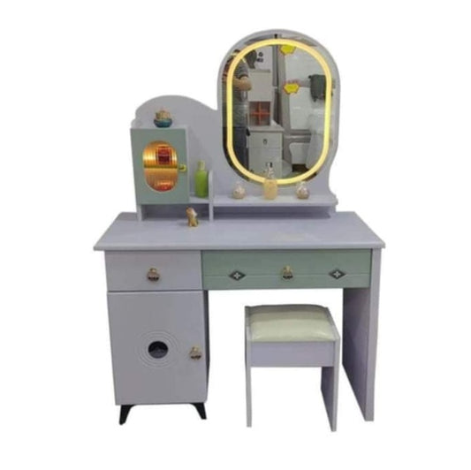 A dressing table featuring a mirror and a matching stool, elegantly arranged for personal grooming and styling.