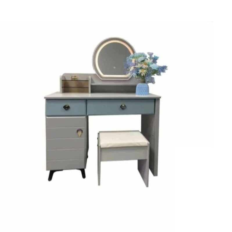 Compact dressing table with a mirror and stool, perfect for a cozy space dedicated to beauty and self-care.