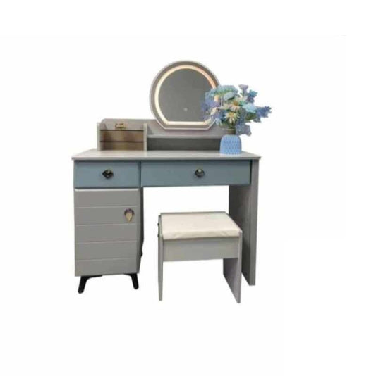Compact dressing table with a mirror and stool, perfect for a cozy space dedicated to beauty and self-care.