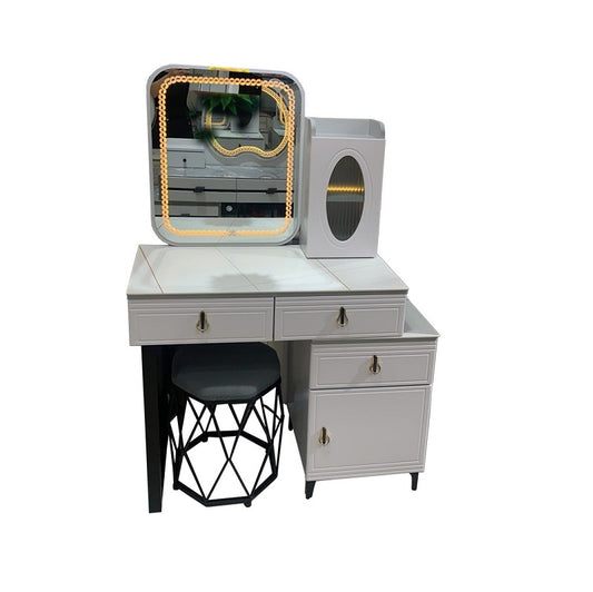 A white vanity featuring a mirror and a matching stool, elegantly arranged for a stylish dressing area.