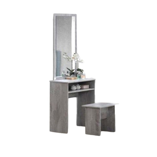 A small dressing table featuring a mirror and a matching stool, elegantly arranged for personal grooming and styling.