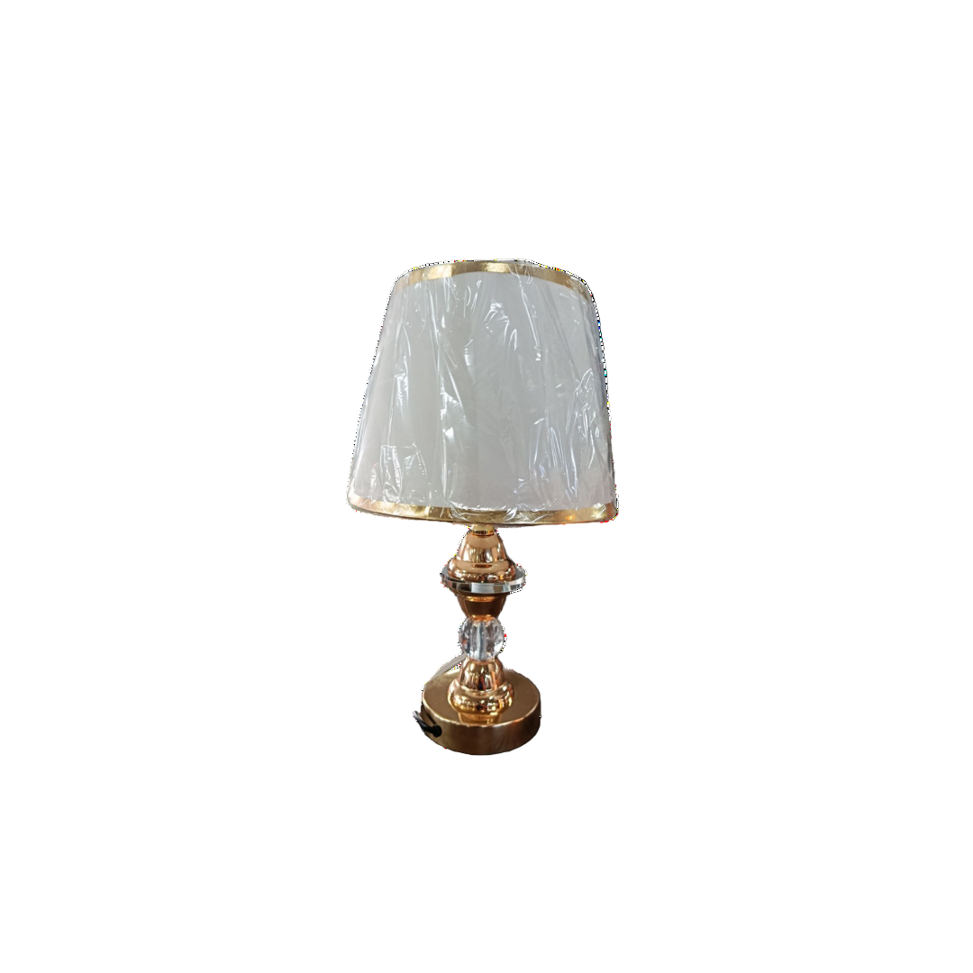 A gold table lamp featuring a white shade, elegantly designed for stylish lighting in any room.