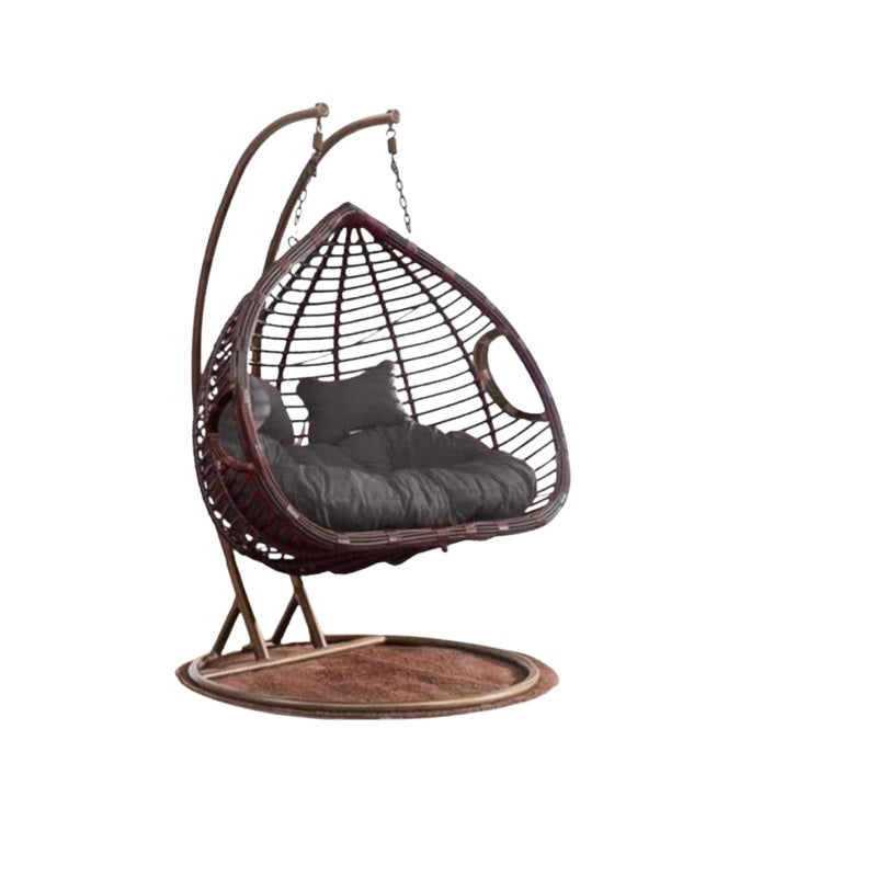 A cozy hanging chair adorned with a vibrant flower pattern, perfect for relaxation and adding charm to any space.