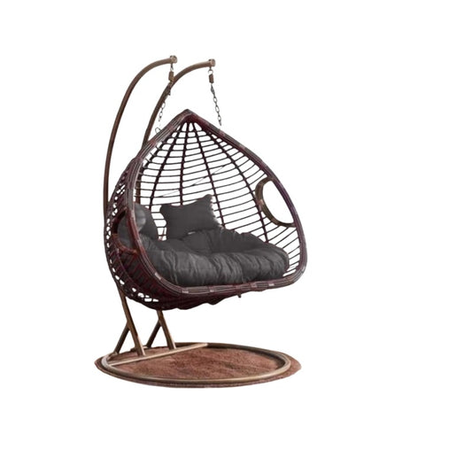 A cozy hanging chair adorned with a vibrant flower pattern, perfect for relaxation and adding charm to any space.