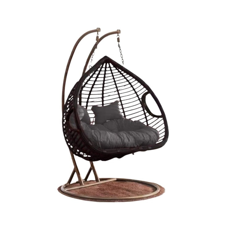 A cozy hanging chair adorned with a vibrant flower pattern, perfect for relaxation and adding charm to any space.
