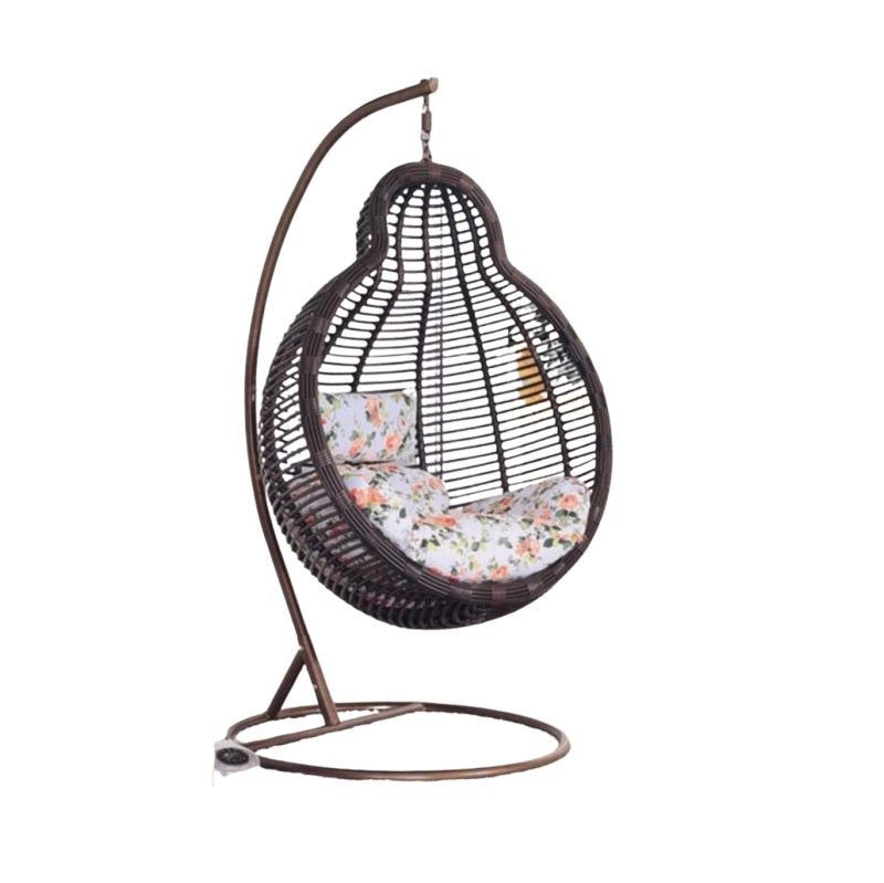 A cozy hanging chair adorned with a vibrant flower pattern, perfect for relaxation and adding charm to any space.