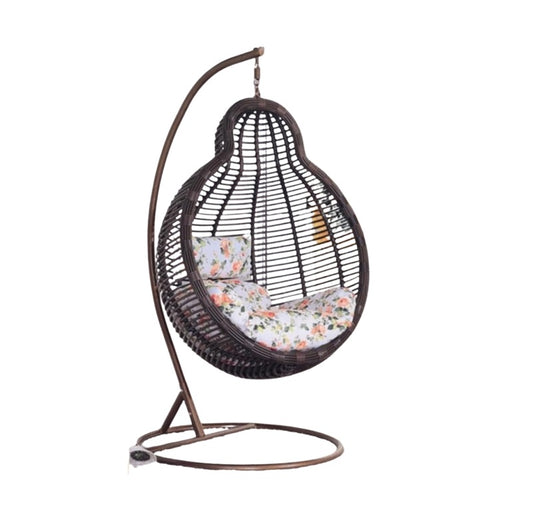 A cozy hanging chair adorned with a vibrant flower pattern, perfect for relaxation and adding charm to any space.