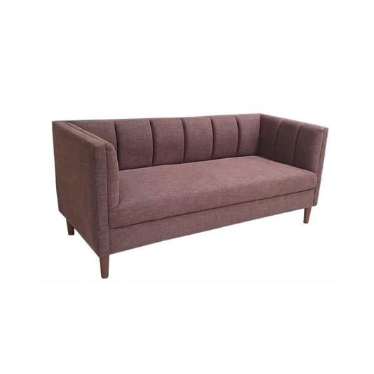 A modern red couch with two accent pillows, offering a chic and comfortable seating option.