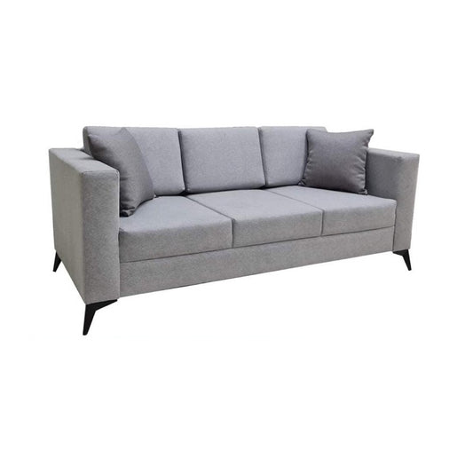 A modern grey couch with two accent pillows, offering a chic and comfortable seating option.