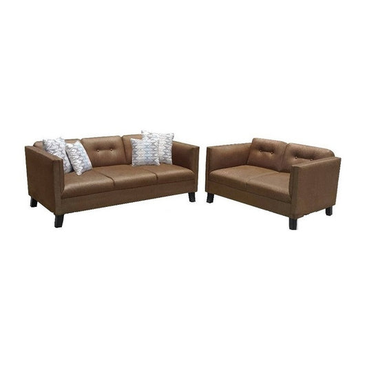A cozy living room featuring two brown leather couches alongside a complementary loveseat.