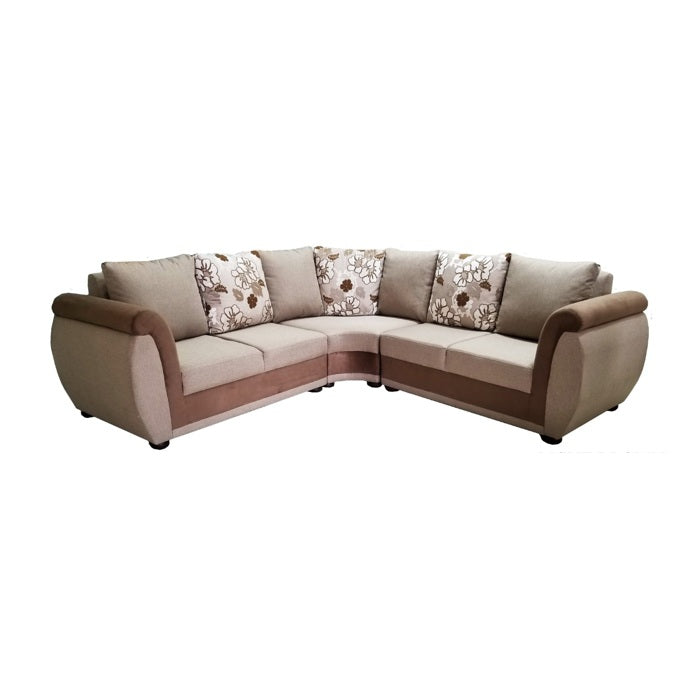 A stylish sectional couch featuring a mix of brown and white pillows, enhancing the comfort of the room.