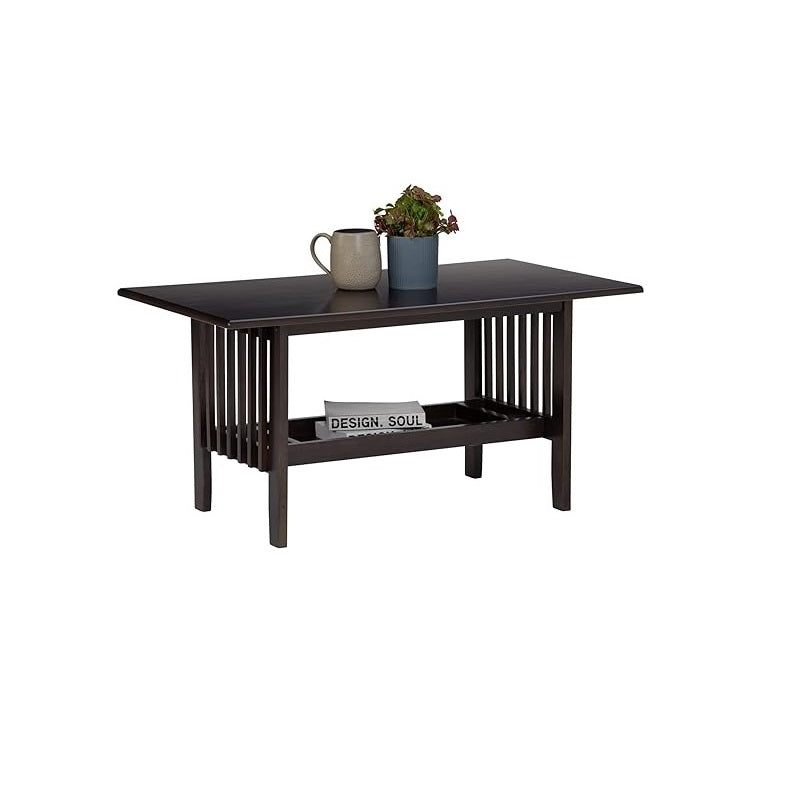 A stylish coffee table adorned with a vase, adding a touch of elegance to the living space.