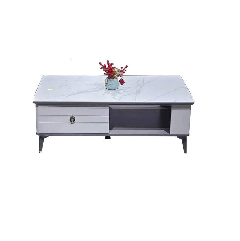 A minimalist white coffee table with a vase, creating a chic and inviting atmosphere.