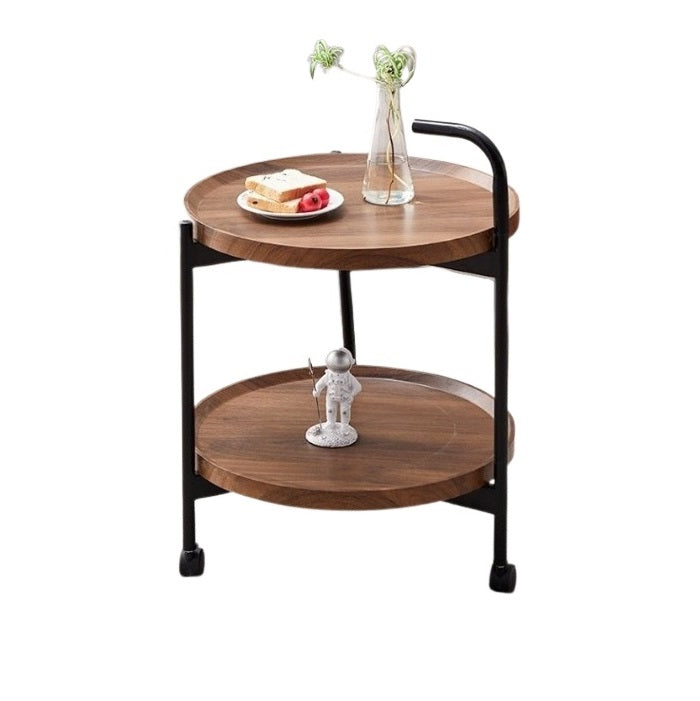 A small circular table adorned with a plate, creating a cozy and stylish atmosphere for dining or gatherings.