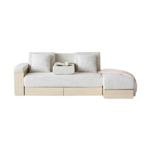A modern sofa bed showcasing a supportive mattress and inviting pillows, designed for comfort and versatility in any space.