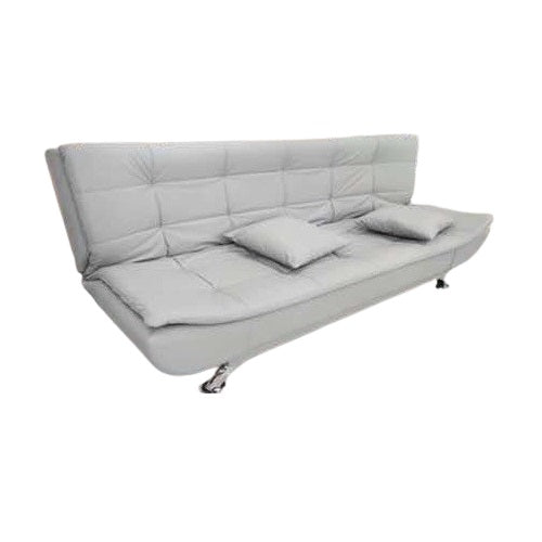 A stylish sofa bed equipped with a soft mattress and decorative pillows, ideal for both seating and sleeping.