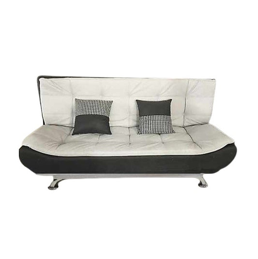 A sleek grey leather sofa featuring plush pillows, enhancing the elegance and comfort of the living space.
