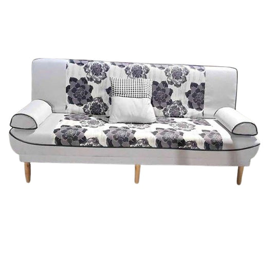 A stylish couch featuring a colorful floral design, enhancing the room's aesthetic appeal.