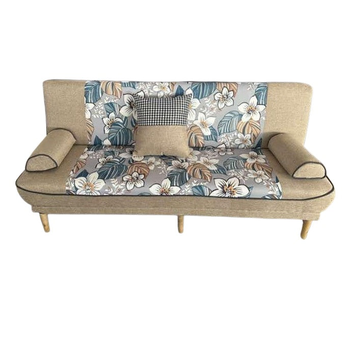 A stylish couch featuring a colorful floral design, enhancing the room's aesthetic appeal.