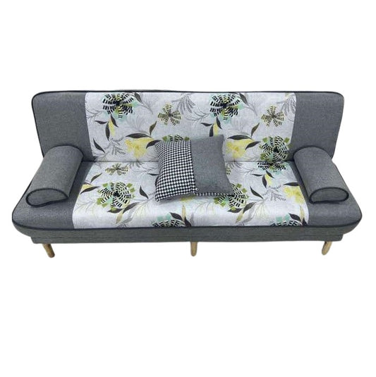 A stylish couch featuring a colorful floral design, enhancing the room's aesthetic appeal.