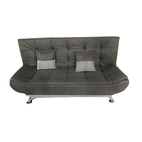 A sleek grey leather sofa featuring plush pillows, enhancing the elegance and comfort of the living space.