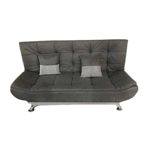 A sleek grey leather sofa featuring plush pillows, enhancing the elegance and comfort of the living space.