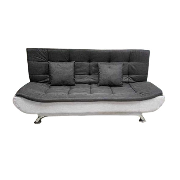 A sleek grey leather sofa featuring plush pillows, enhancing the elegance and comfort of the living space.