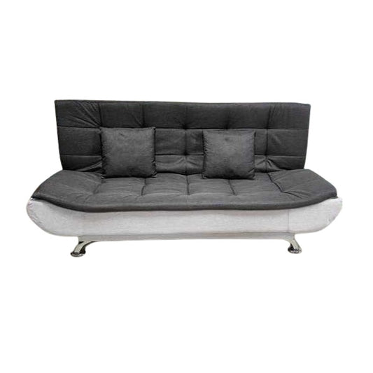 A sleek grey leather sofa featuring plush pillows, enhancing the elegance and comfort of the living space.